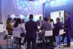 People hosting a meeting at HETI House at CERAWeek 2026